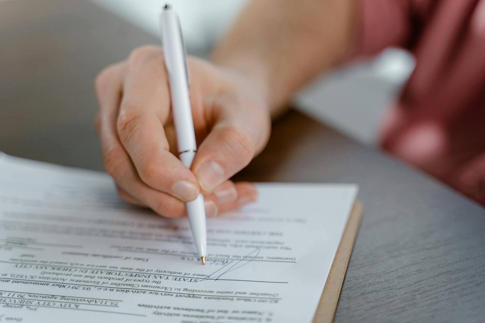 Vendor contract documents on a desk in a Namur office
